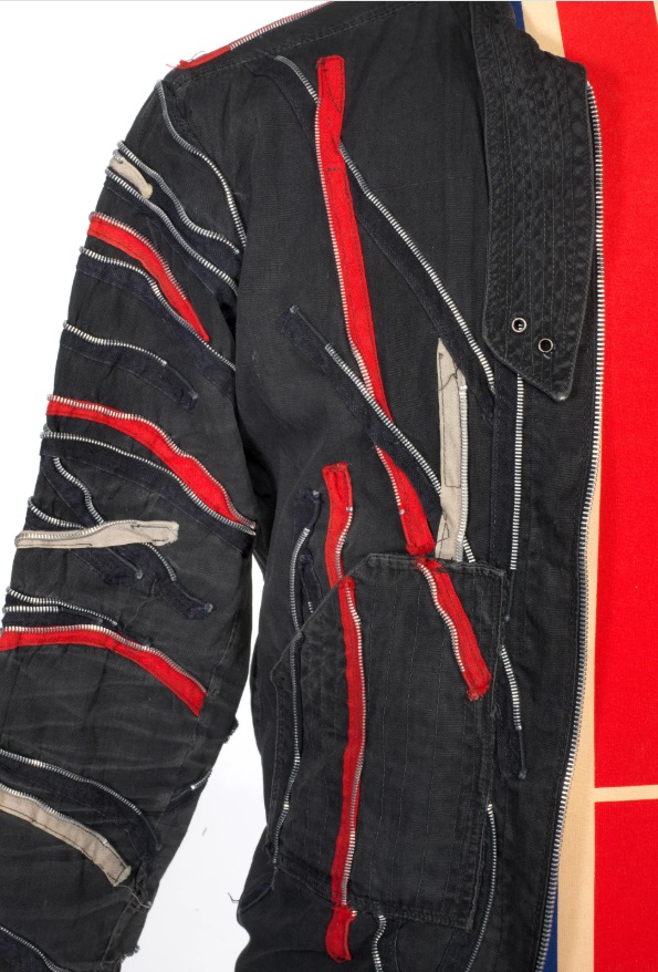 A custom jacket with red & white stripes & silver metal zipper teeth worn by Joe during 1977-1979.