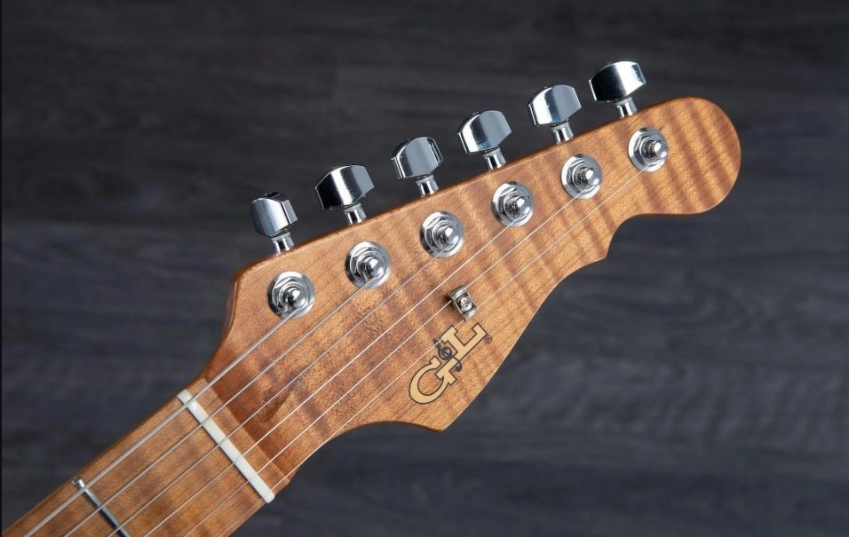 Hero image of a Blue G and L guitar resting against shelving in Leo Fender's work area