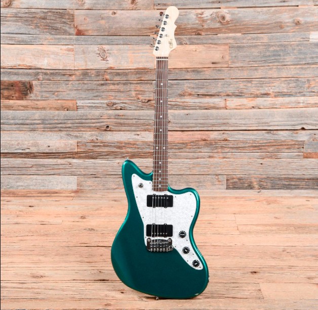 Flake Blue jaguar style guitar with natural wood headstock, black hardware, white pickguard