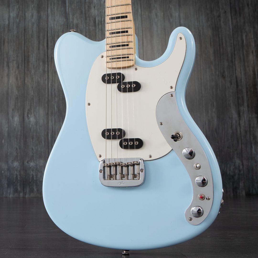 Lower end of a cream blue G and L guitar with alternating MFD pickup setup