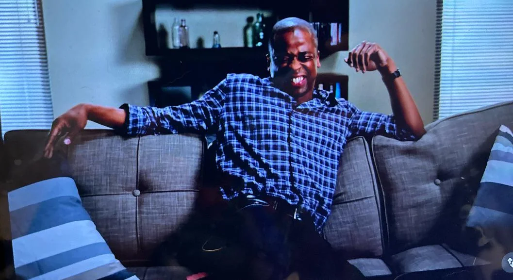 photo of Gus on his own couch, obviously drugged