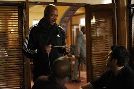 photo of Ed Lover as himself in the police station getting his bling back from Gus