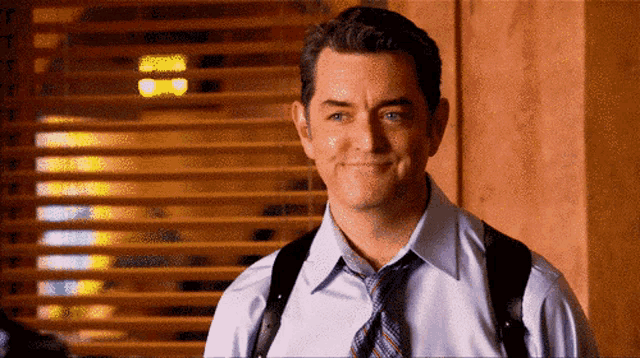 photo of Carlton Lassiter with a wry smile in psych