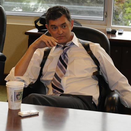 photo of Carlton Lassiter relaxing behind a desk in Psych
