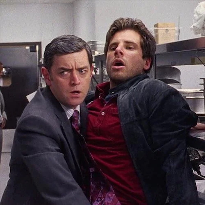 photo of Carlton Lassiter protecting Shawn Spencer in Psych