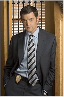 photo of Carlton Lassiter leaning casually against the wall in Psych