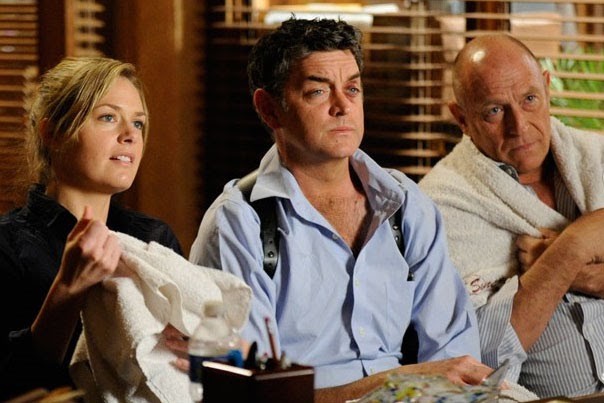 photo of Juliet, Carlton, and Henry in front of Chief Vick's desk making an accounting of where they've been