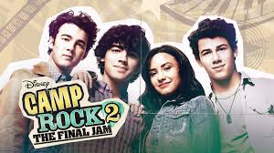 Disney sequel poster showing three young men and a young woman standing in a row, smiling toward the camera, with the title “Camp Rock 2: The Final Jam.”