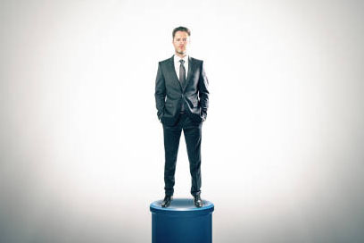 business man standing on a pedastal