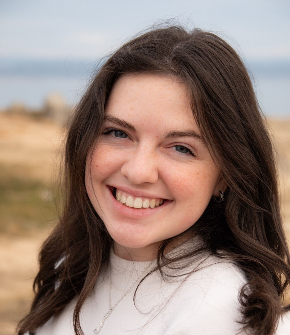 headshot of sidney ciminski, the editor
