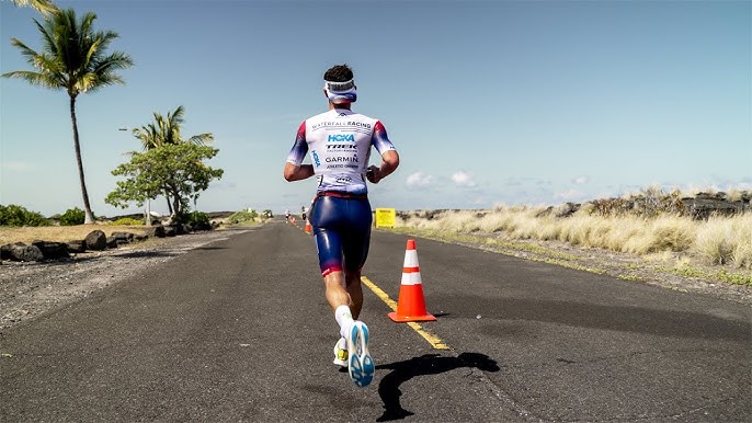 a man running on a road in a desert-like area