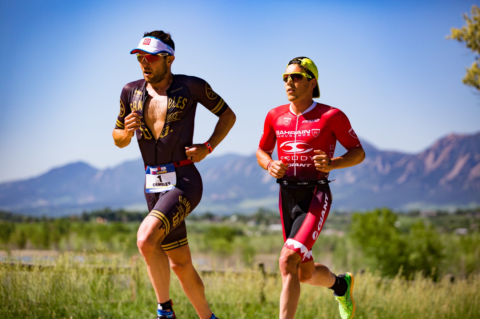 Two men running on a sunny day