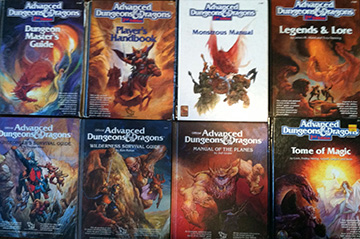 Eight source books from Advanced Dungeons & Dragons 2nd edition. They are all touching one another forming a rectangle of books. Each cover depicts artwork of different monsters or adventurers.