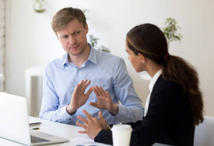 a clipart image of a man shushing a woman