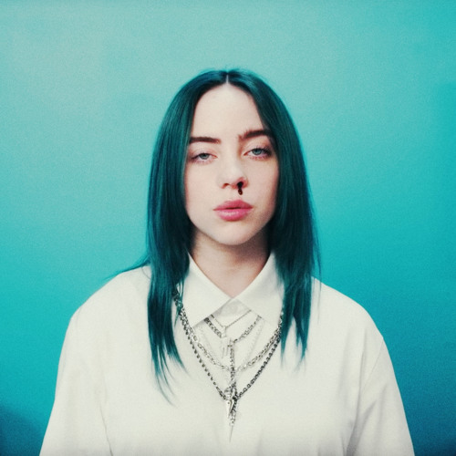 An image of Billie Eilish staring directly into the camera. She has a straight face and she has blood coming out of her nose. She has a white shirt on and the background is blue