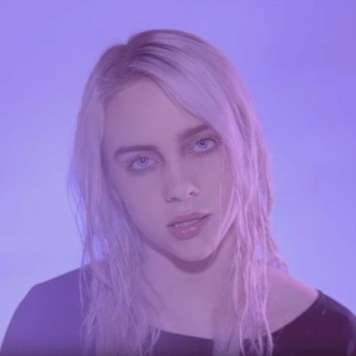 An image of a blonde Billie Eilish looking into the camera with wet hair