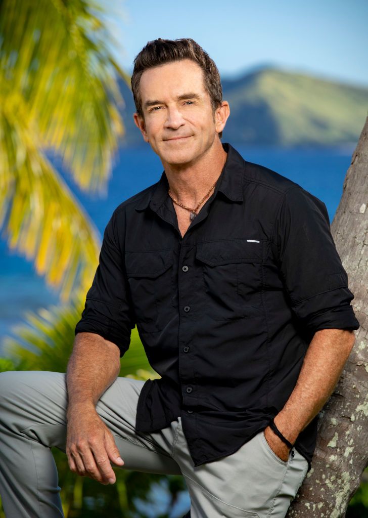 Jeff Probst looking like an absolute stud leaning up against a palm tree.