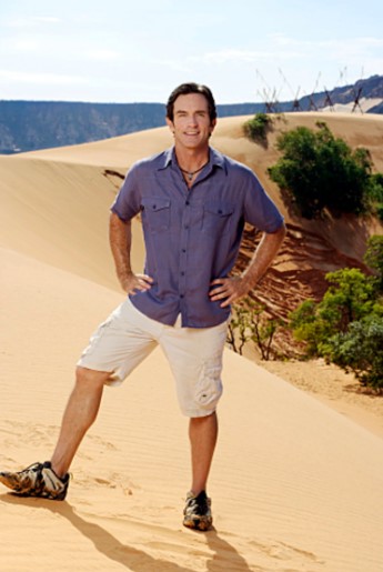 Jeff Probst standing on a beach with his hands on his hips.