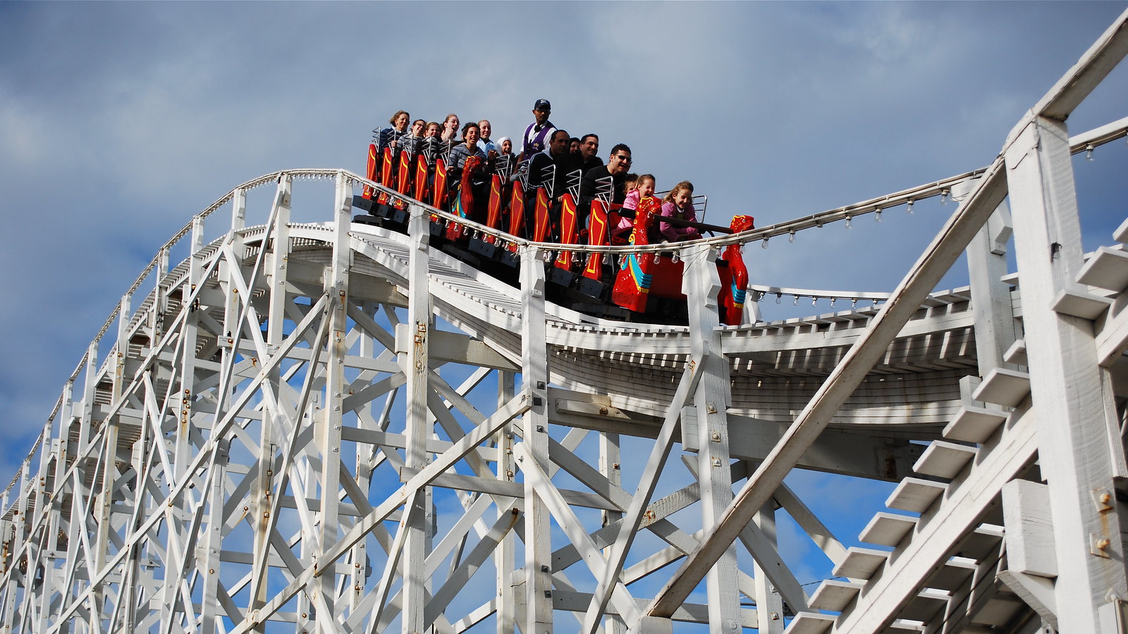 Riders go down a hill on the Scenic Railway, a roller coaster in Melbourne, Australia