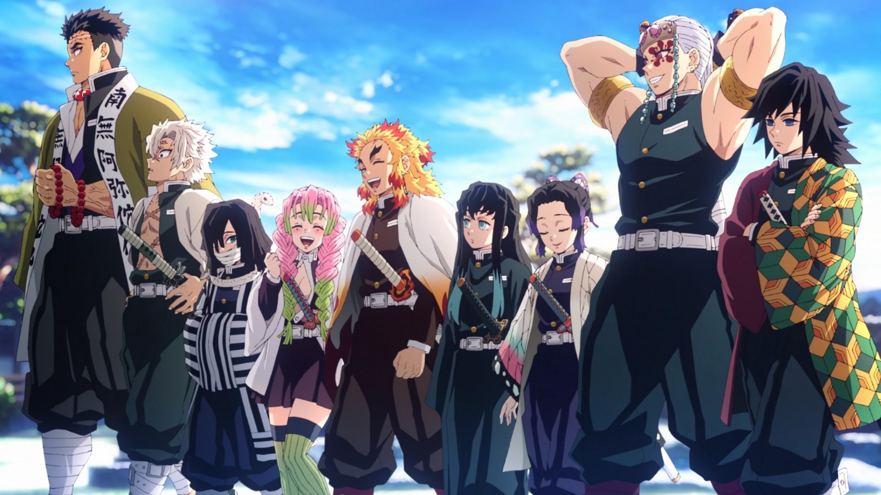 A group of 9 men and women of different sizes, each wearing the black Demon Slayer uniform. Some having different colored haori's over top, with sheathed katanas at their sides, and some engaging in a lively conversation.