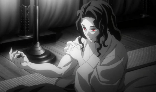 A black and white image of Muzan Kibutsuji right after being turned into a demon. He has long dark hair and red eyes and is sitting up in his bed while holding onto his stronger-looking right arm.