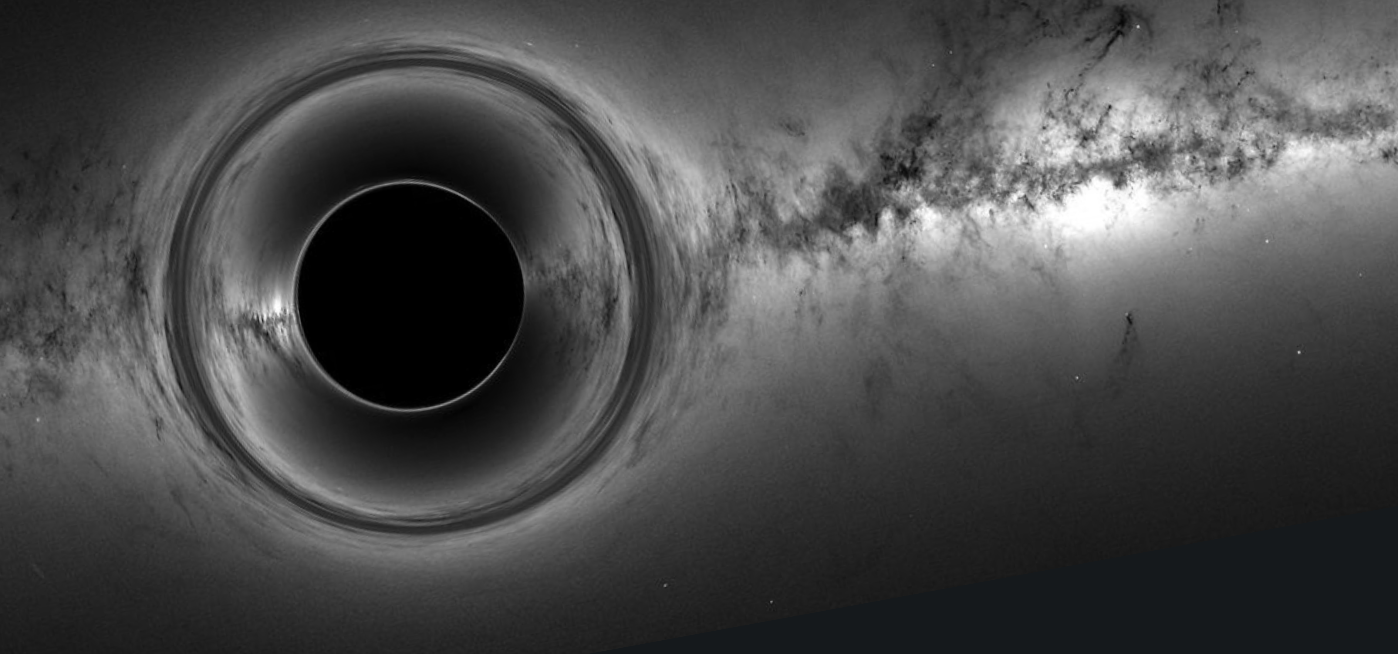 a black and white photograph of a black hole in outer space