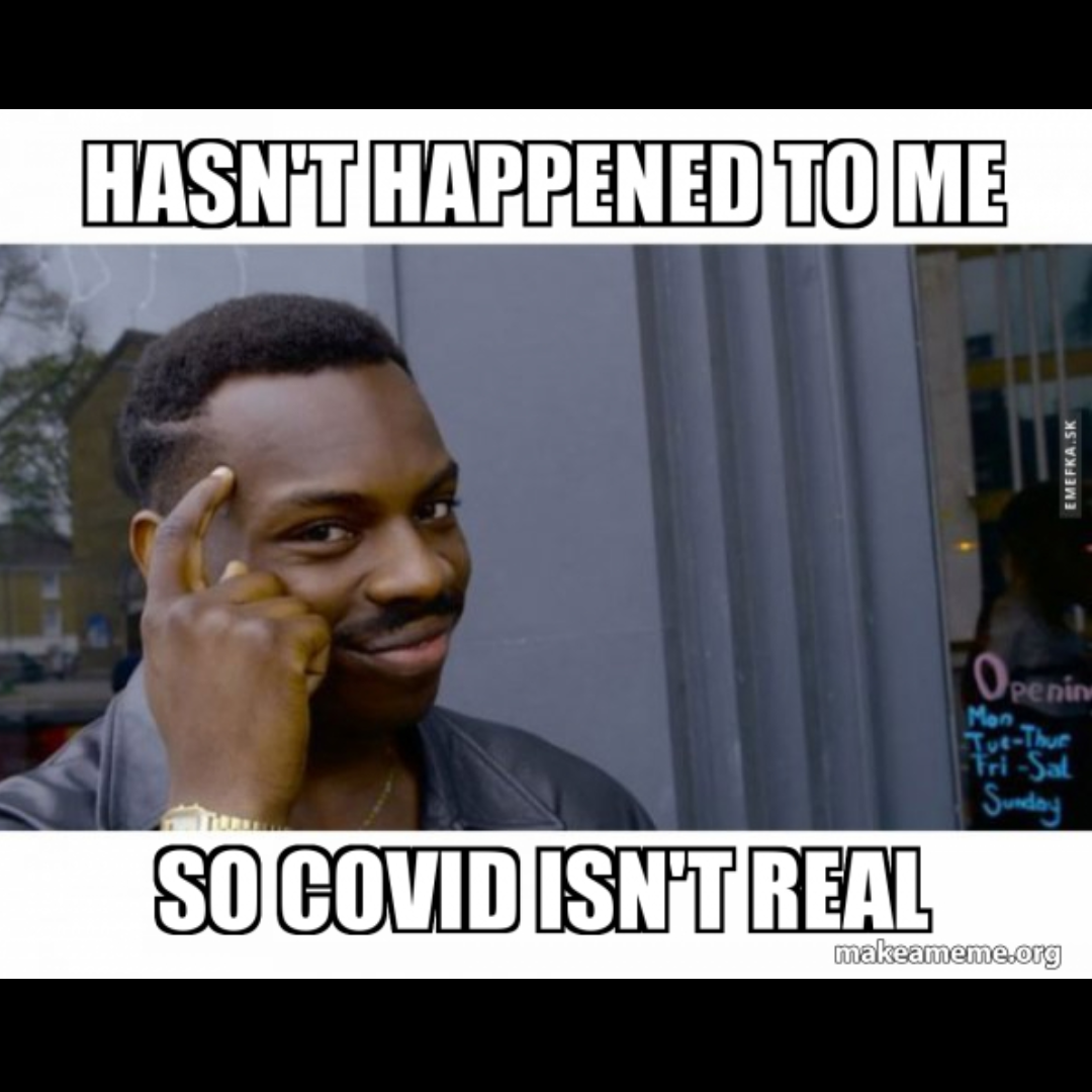 a photo of a man pointing to the side of his head with a knowing expression on his face and a caption that reads: 'hasn't happened to me, so Covid isn't real.'