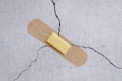 bandaid covering a crack in the concrete