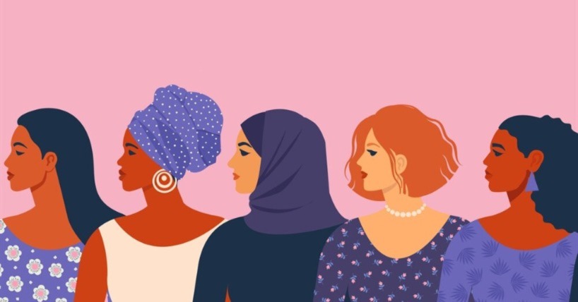 a bright graphic illustration of a row of five women of various races and skin tones facing left set against a pink backdrop