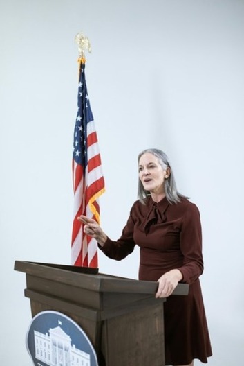 Woman speaking at a political debate