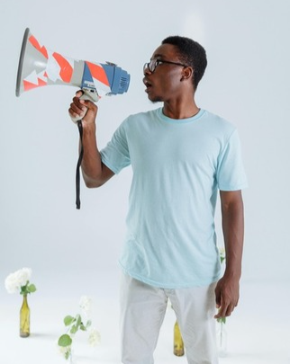 man speaking into a megaphone