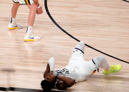 Donovan Mitchell lying on the floor just after he missed a game winning shot to send the Utah Jazz to the Western Semi-finals.