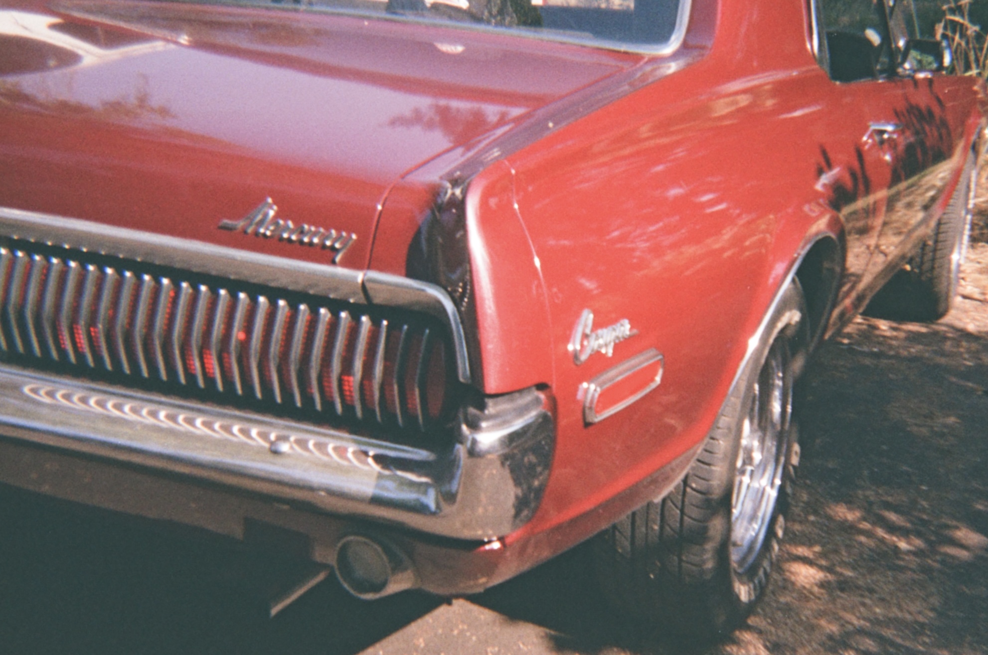 Photo of red Mercury cougar.