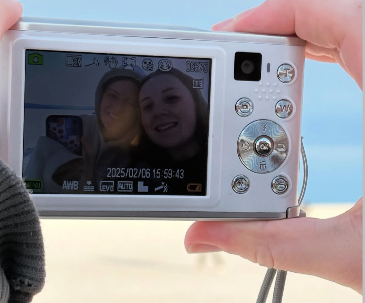 Digital camera being used.