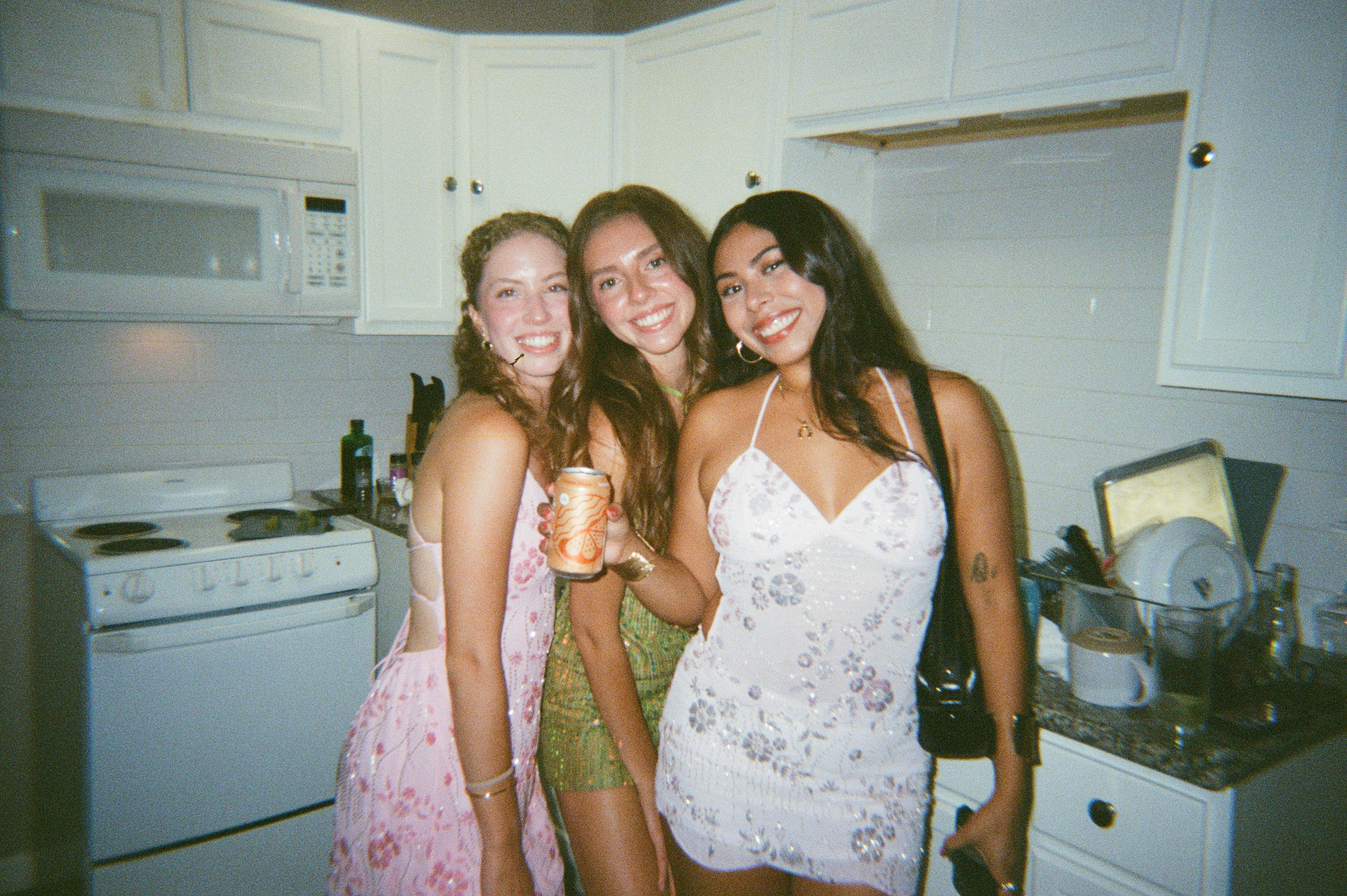 Three girls in sparkly dresses