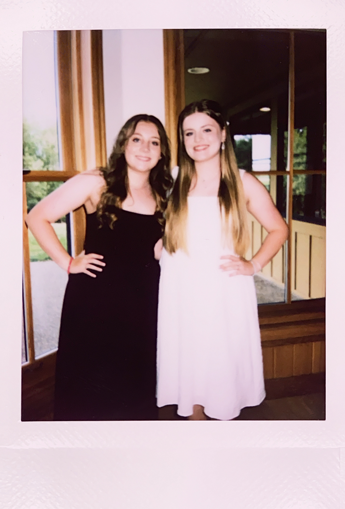 Two young women at a rehearsal dinner.