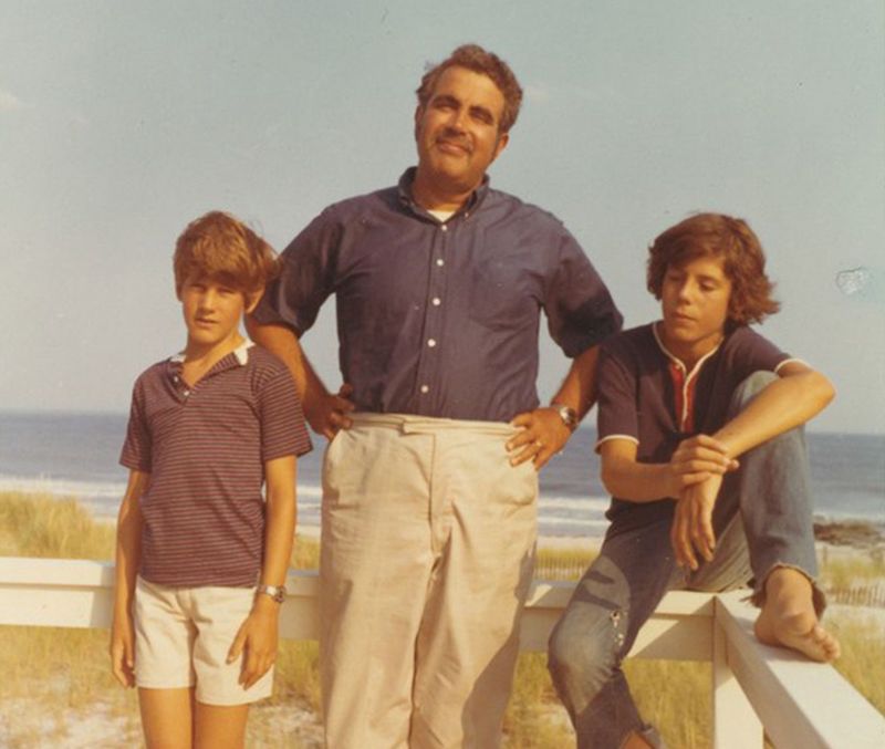 Bourdain as a child posing at the beach with his father and brother.