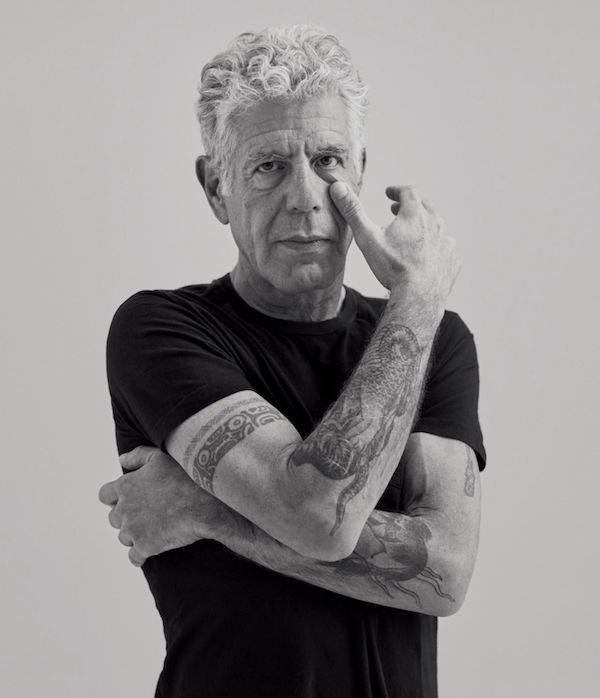 One of the last photos taken of Bourdain. Though he is posing for the staged photo, he cannot hide the exhaustion and pain in his eyes.