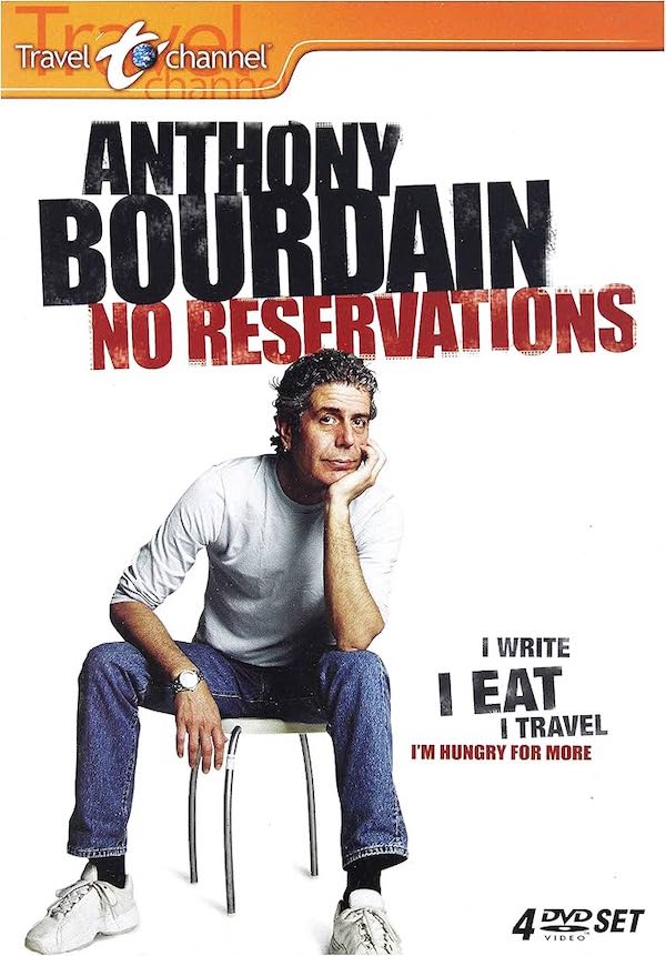 White TV poster. A grey haired Bourdain sits on a stool, hand on face, staring at the camera in casual clothes.